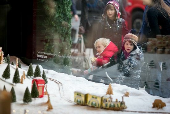 Kids looking in show window at Christmas display