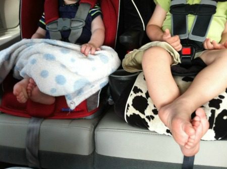 Two kid in car seats