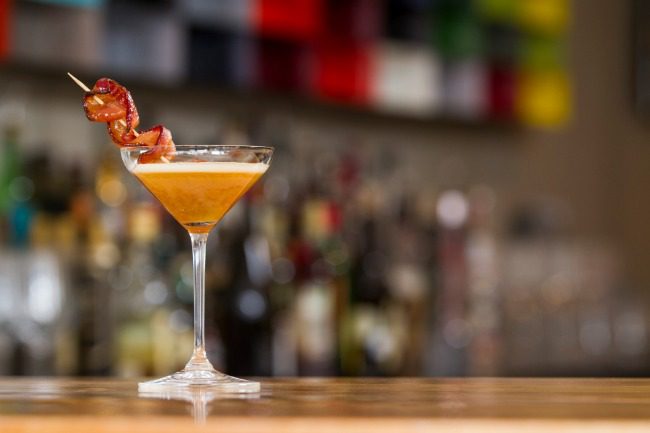 Cocktail with bacon garnish