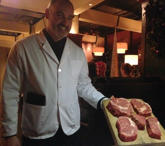 Waiter with steak board