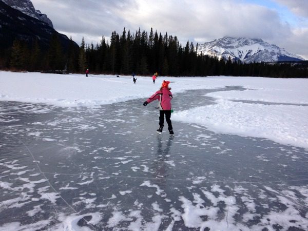 kid skating outdoor ice rink canada