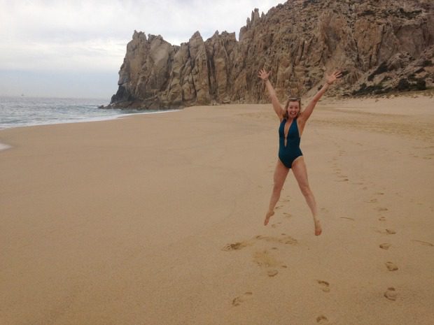 woman-jumping-on-beach
