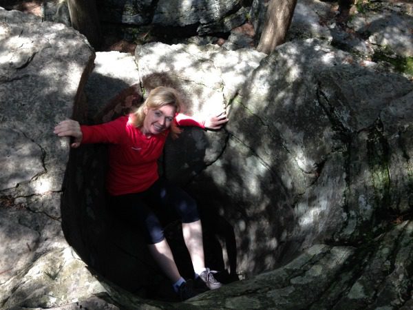 woman inside rock kettle