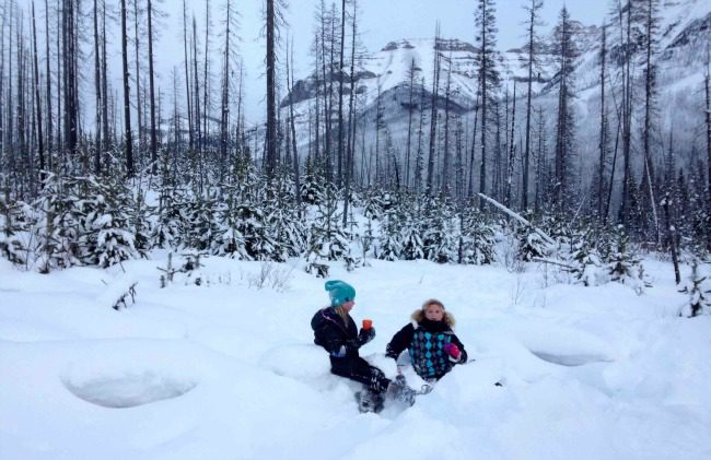 girls drinking hot chocolate in the snow