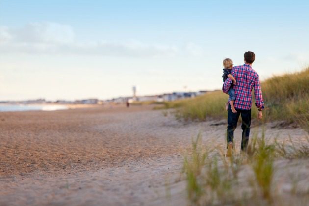 Man and son on beach