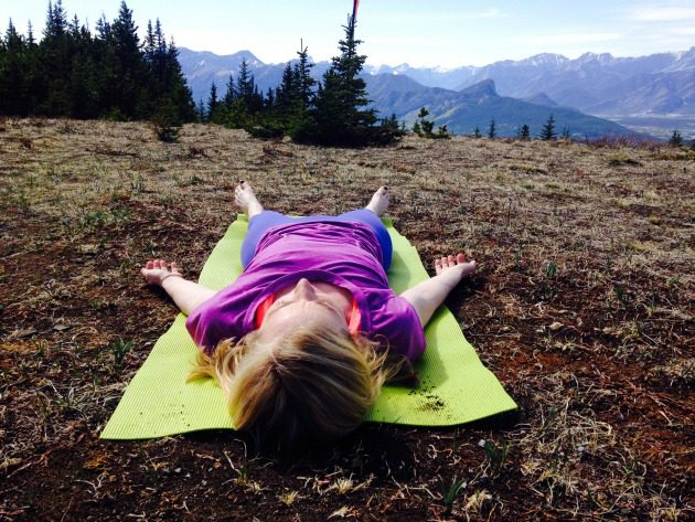Woman laying on yoga mat