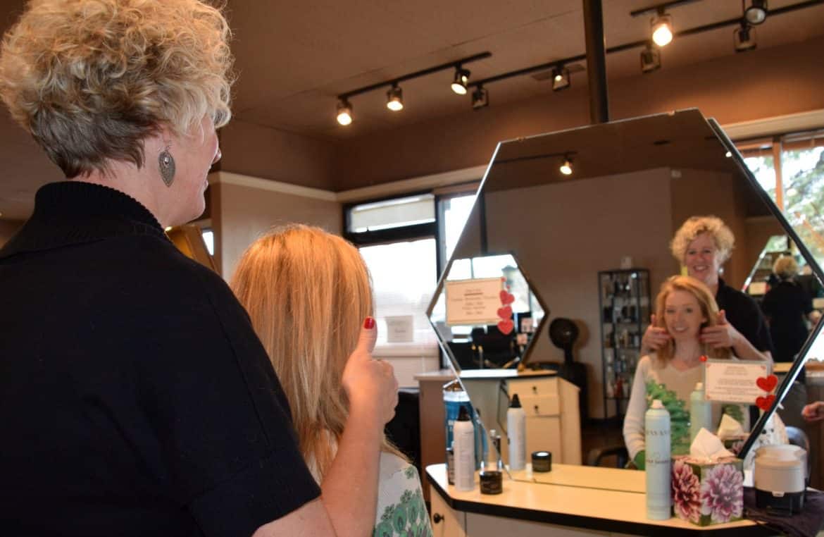 woman getting hair styled