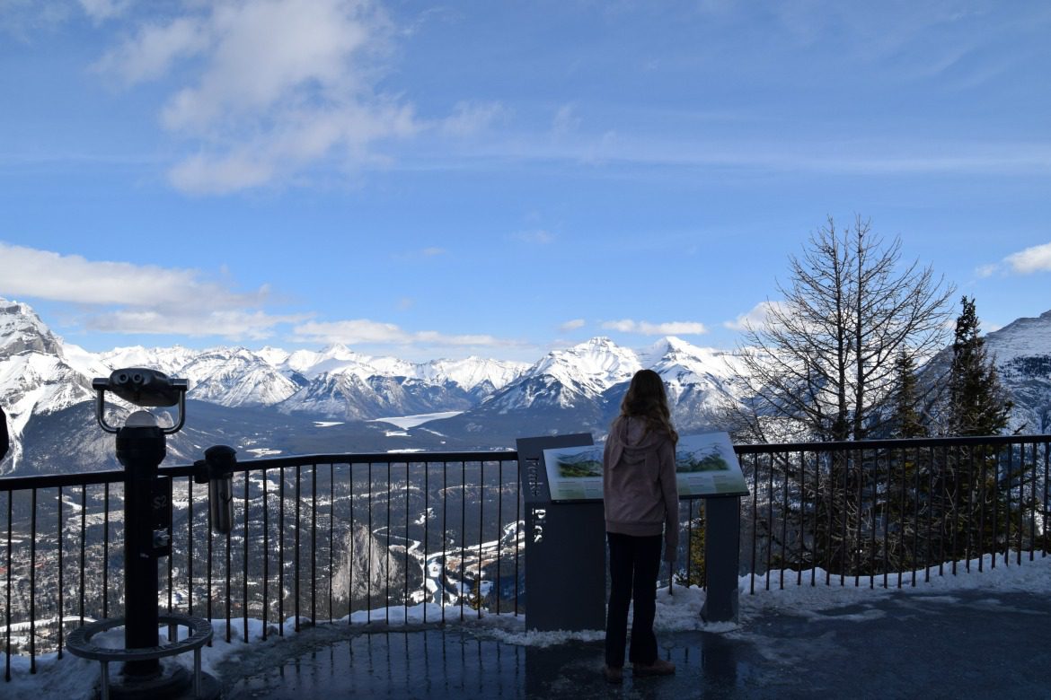 Girl looking at mountains from Banff Gondol