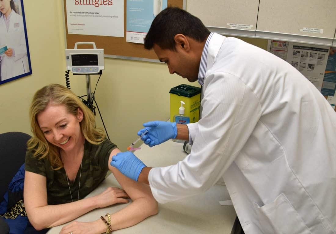 woman gets a shot from dr