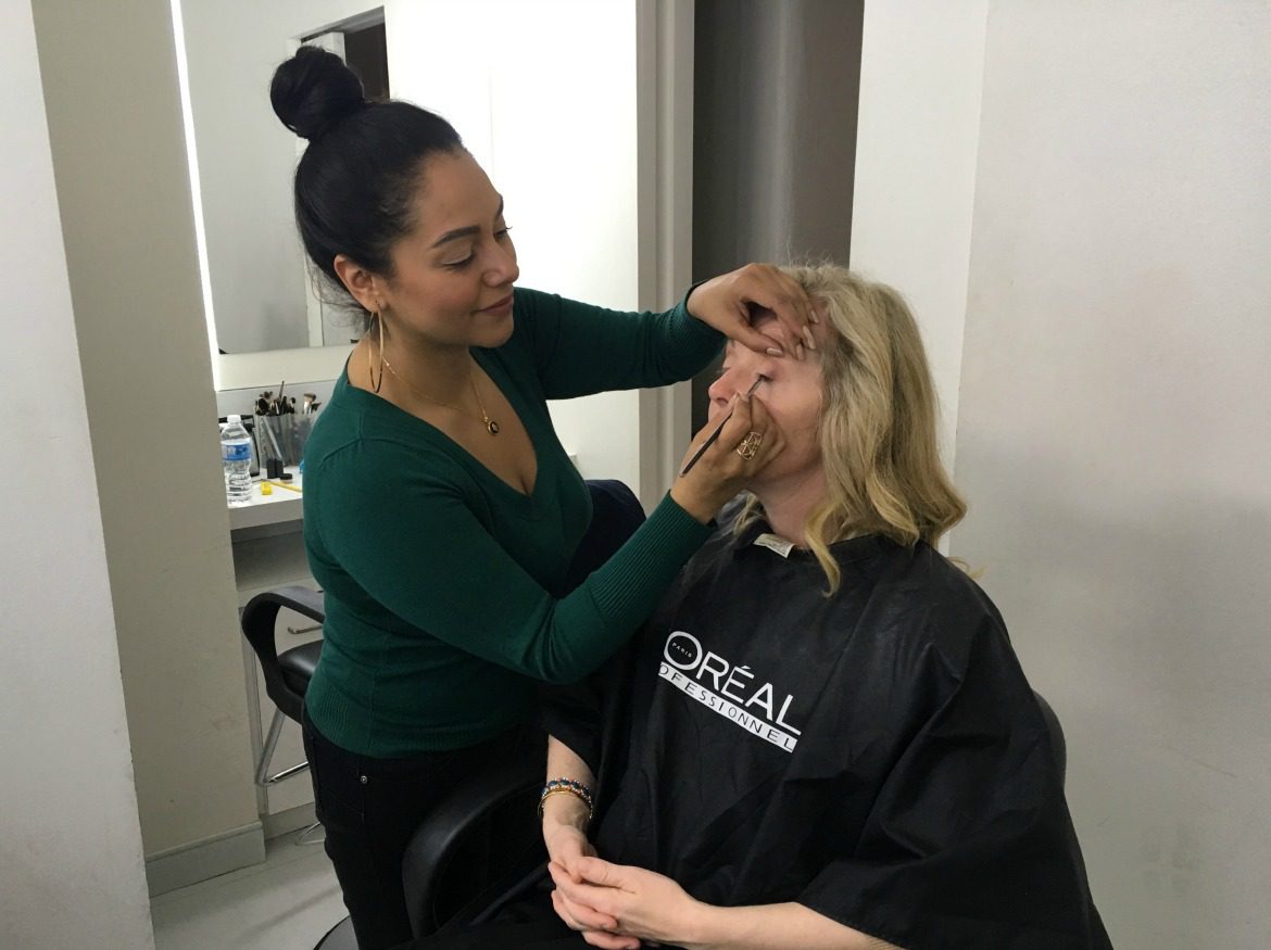 woman getting TV make up done