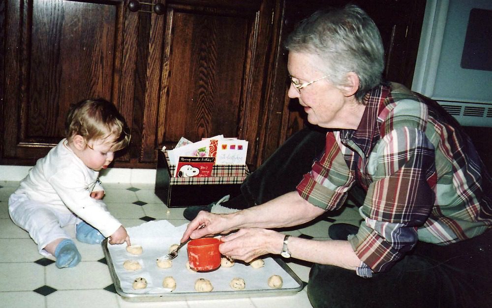 baby helping make cookies