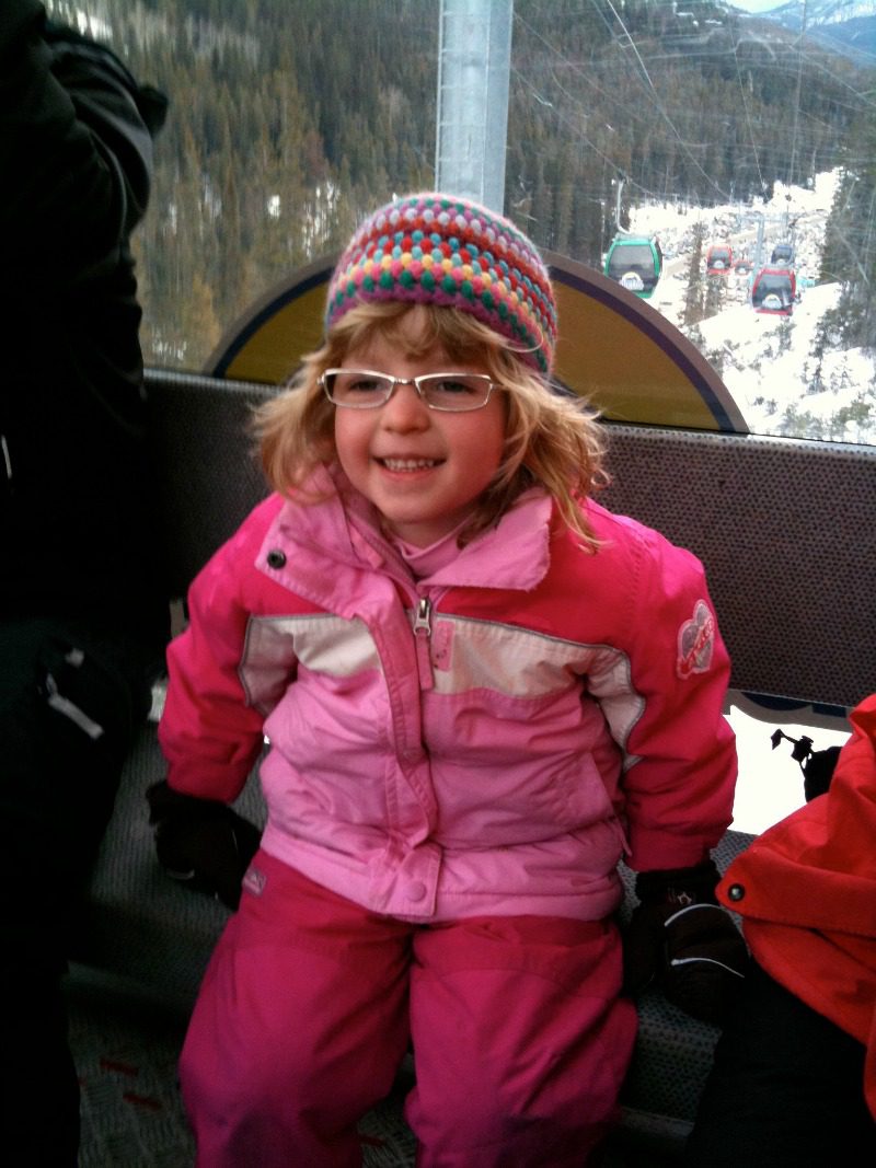 girl taking gondola in winter