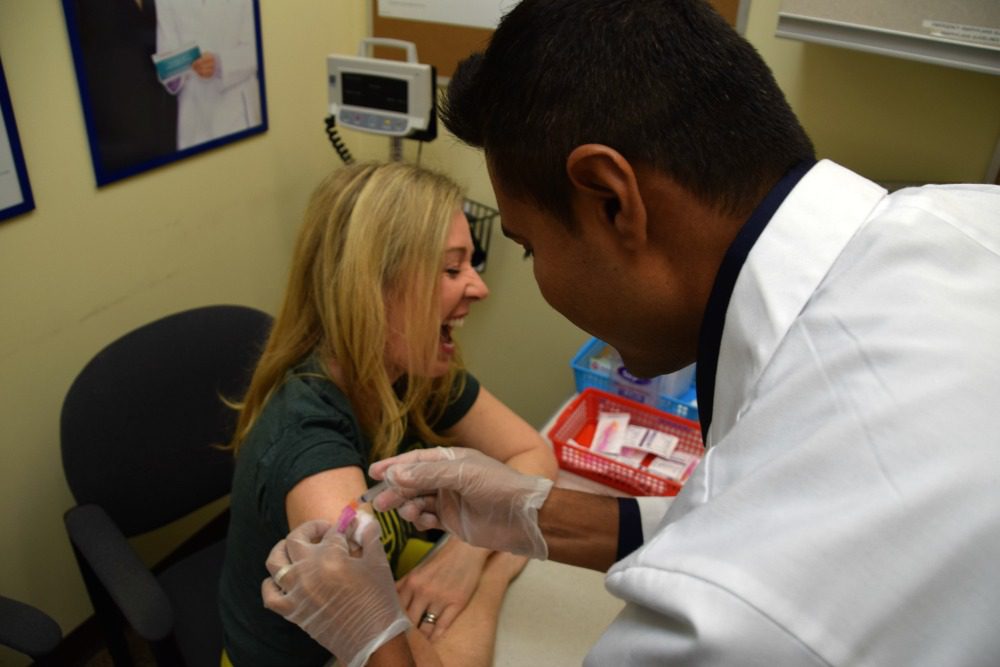 woman getting flu vaccine