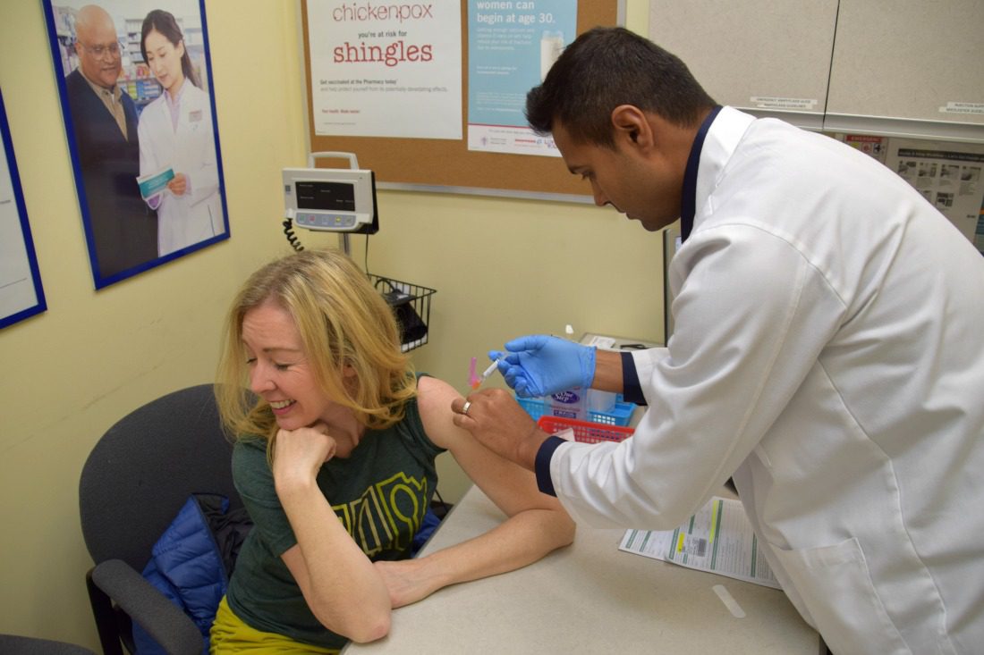 woman getting flu vaccine