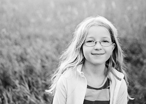 little kid wearing glasses