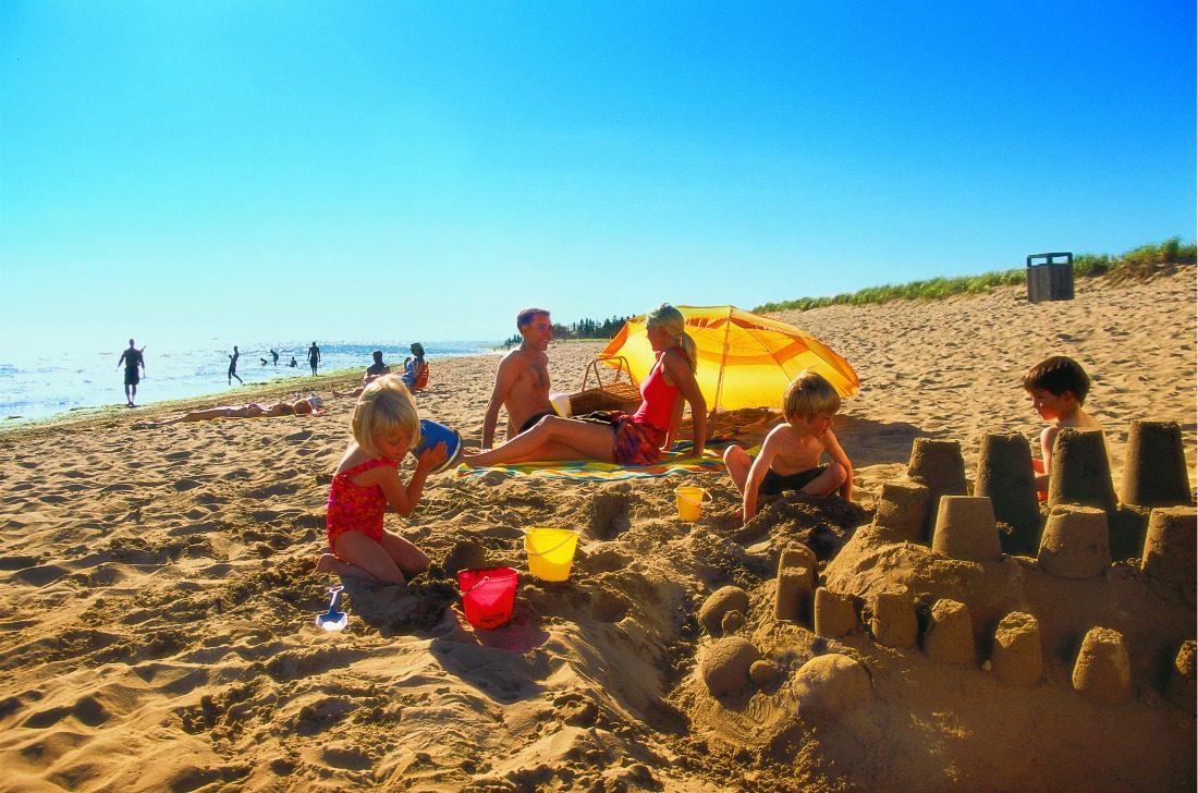 family sand castle beach