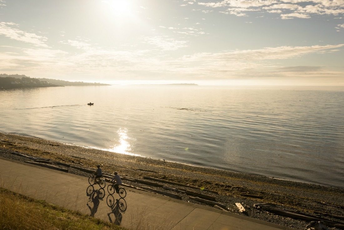 biking along the ocean at sunset